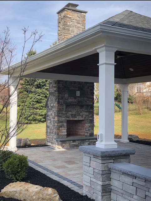 Stone fireplace and chimney under a covered pavilion in the Lehigh Valley, PA