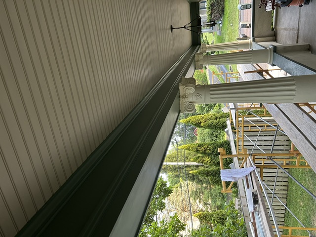 Finished porch ceiling with columns and detailed trim