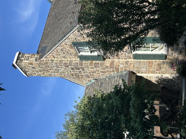 Full stone chimney and stone facade on residential home